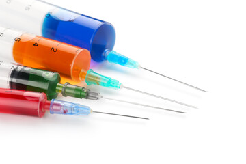 Different medical syringes with vaccine on white background, closeup