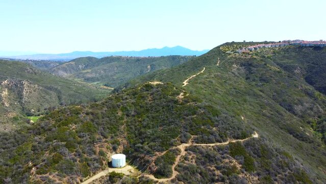 Aerial views of the lush green walls of Aliso and Wood Canyons Wilderness Park in the San Joaquin Hills of Orange County, California.