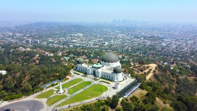 Aerial drone view of Griffith Park observatory, downtown Los Angeles skyline. California travel destination in America.