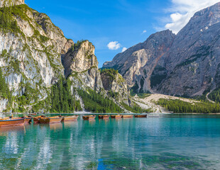 Braies Lake, Italy. Group of the traditional rowing boats. Alpine lake. Picturesque mountain lake in Dolomites. Wonderful nature contest