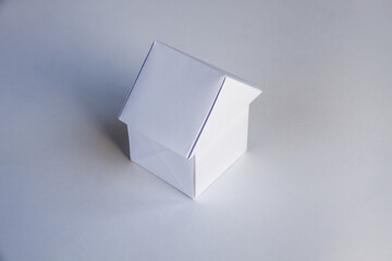 Paper house origami isolated on a white background