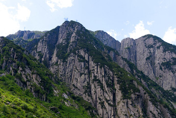 Fototapeta na wymiar Scenic view of rocks and mountains at Schöllenen Gorge, Canton Uri, on a sunny summer day. Photo taken July 3rd, 2022, Schöllenen Gorge, Switzerland.