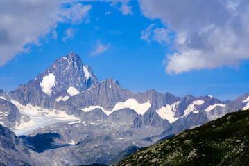 Swiss Alps with Rhone Glacier seen from Swiss mountain pass Nufenen on a sunny summer day. Photo taken July 3rd, 2022, Nufenen Pass, Switzerland.