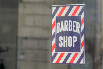 barber shop text sign in wall facade entrance hairdresser in windows sticker white red blue colors