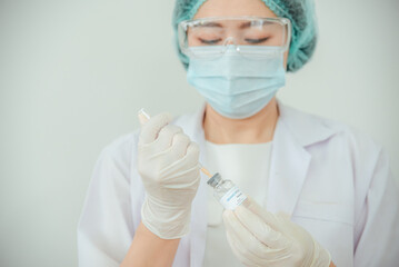 A doctor or scientist is holding a vaccine vial for monkeypox or clade.