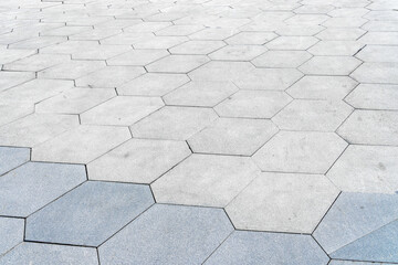 The texture of hexagonal tiled pavement with perspective.