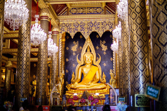 PHITSANULOK, THAILAND - JUL 27 2022 : Golden Buddha statue in Wat Phra Sri Rattana Mahathat Temple, Phitsanulok in Thailand