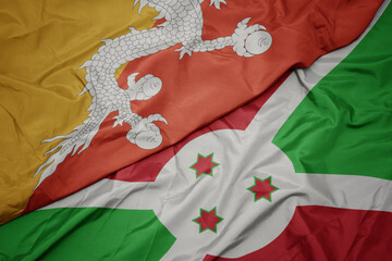 waving colorful flag of burundi and national flag of bhutan.