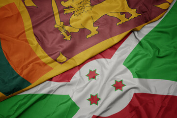 waving colorful flag of burundi and national flag of sri lanka.