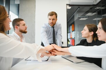 Corporate business team and manager in a meeting room at modern office with panoramic windows. Business concept