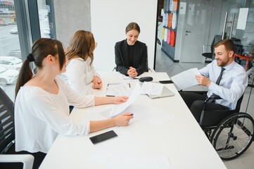 Corporate business team and manager in a meeting room at modern office with panoramic windows. Business concept