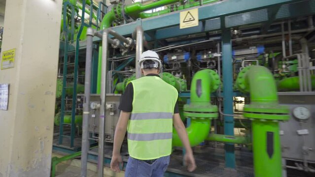 Engineer checking Valves in factory.
The engineer is checking the valves and working.
