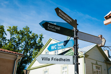 Sign pointing to different sights and tourist attractions in Haapsalu, Estonia. Travel information signpost for Haapsalu visitors. 