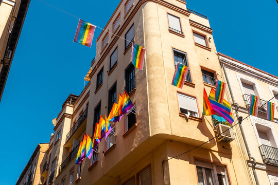 lgbt flags hanging in the streets and balconies at the pride party in madrid