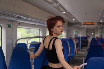 Obraz premium teenager girl in a commuter train car