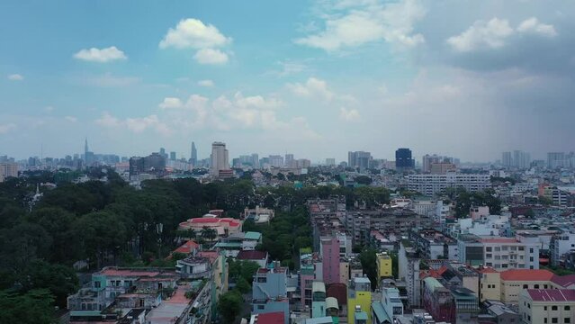 Aerial view from Cho lon  or Chinatown district of Ho Chi Minh City, Vietnam. Sunny view. Long ascending crane shot of skyline.
