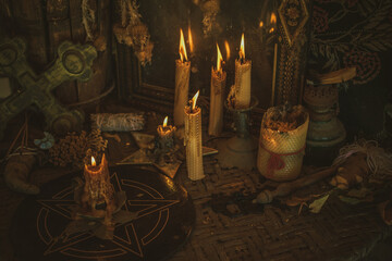Candle burns on the altar, magic among candles, clean negative energy, wicca concept