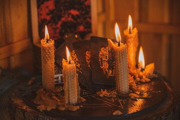 Candle burns on the altar, magic among candles, clean negative energy, wicca concept
