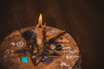 Candle burns on the altar, magic among candles, clean negative energy, wicca concept