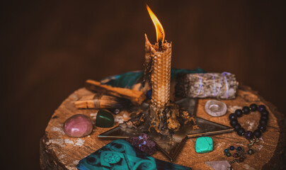 Candle burns on the altar, magic among candles, clean negative energy, wicca concept