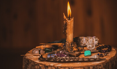 Candle burns on the altar, magic among candles, clean negative energy, wicca concept