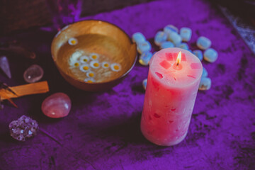 Candle burns on the altar, magic among candles, clean negative energy, wicca concept