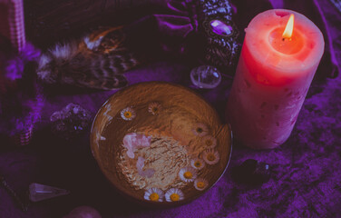 Candle burns on the altar, magic among candles, clean negative energy, wicca concept