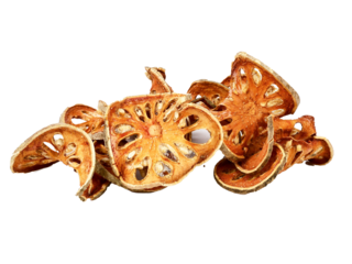 Aegle marmelos. Dry bael fruit isolated on white background.Dried herbs and dried bael fruit drink Healthy and Natural Food concept