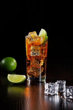 Cola With Lime Wedge And Ice. Side View, Selective Focus.