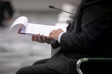 Businessman looking at a document in his briefcase