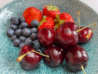 Fruit plate with blueberries, strawberries and cherries