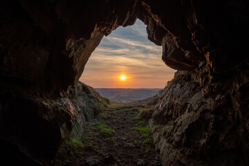 Sunset on the last hiding place of king Caractacus, a cave on the hill fort of Caer Caradoc in Shropshire, England - Powered by Adobe