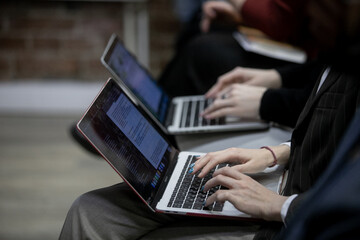 Press conference, man, businessman, typing on a laptop