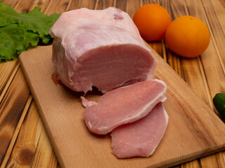 Fresh raw steaks on wooden desk. Preparing for frying. Pork steak.