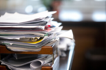 Pile of unfinished documents on office desk, Stack of business paper