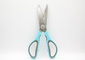 Scissors on the white background