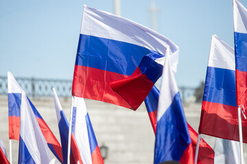 Russian flag fluttering on the blue sky background