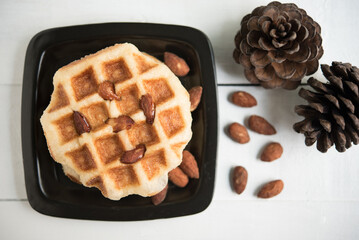 belgian waffles top chocolate  on white wooden background, top view.