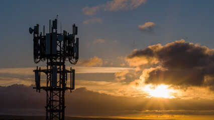 Sunrise over a telecoms tower in west yorkshire