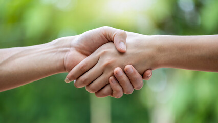 close up of two hands holding each other