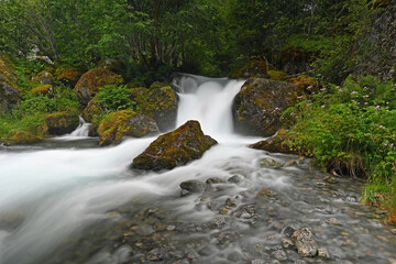 Tranquile waterfall in green surroundings in Norway