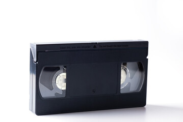 Black plastic video cassette on a white background.