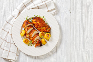 grilled chicken breasts with browned new potatoes