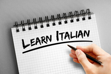 Learn Italian text on notepad, concept background