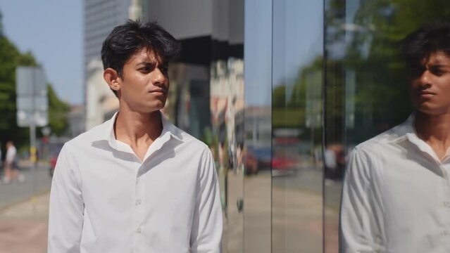 Pensive business sales man worried fired by job, looking at his reflection