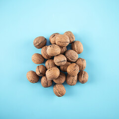 Top view walnuts on blue background