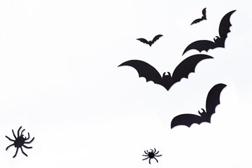 Halloween decorations concept. Halloween with spiders, black bats on white background. Flat lay, top view, copy space.