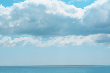 Naklejka na ściany i meble PIcturesque view of calm sea under cloudy sky