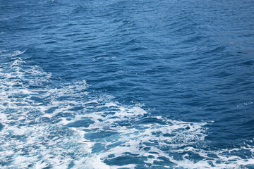 Surface of beautiful sea water with foam as background