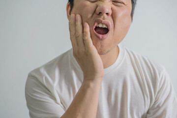 Dental problems concept. man suffering from bad toothache